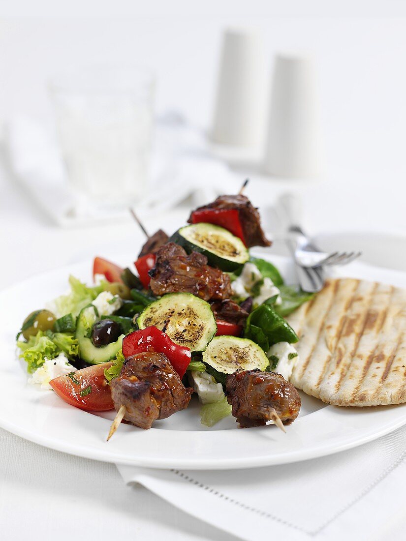 A lamb kebab with courgette