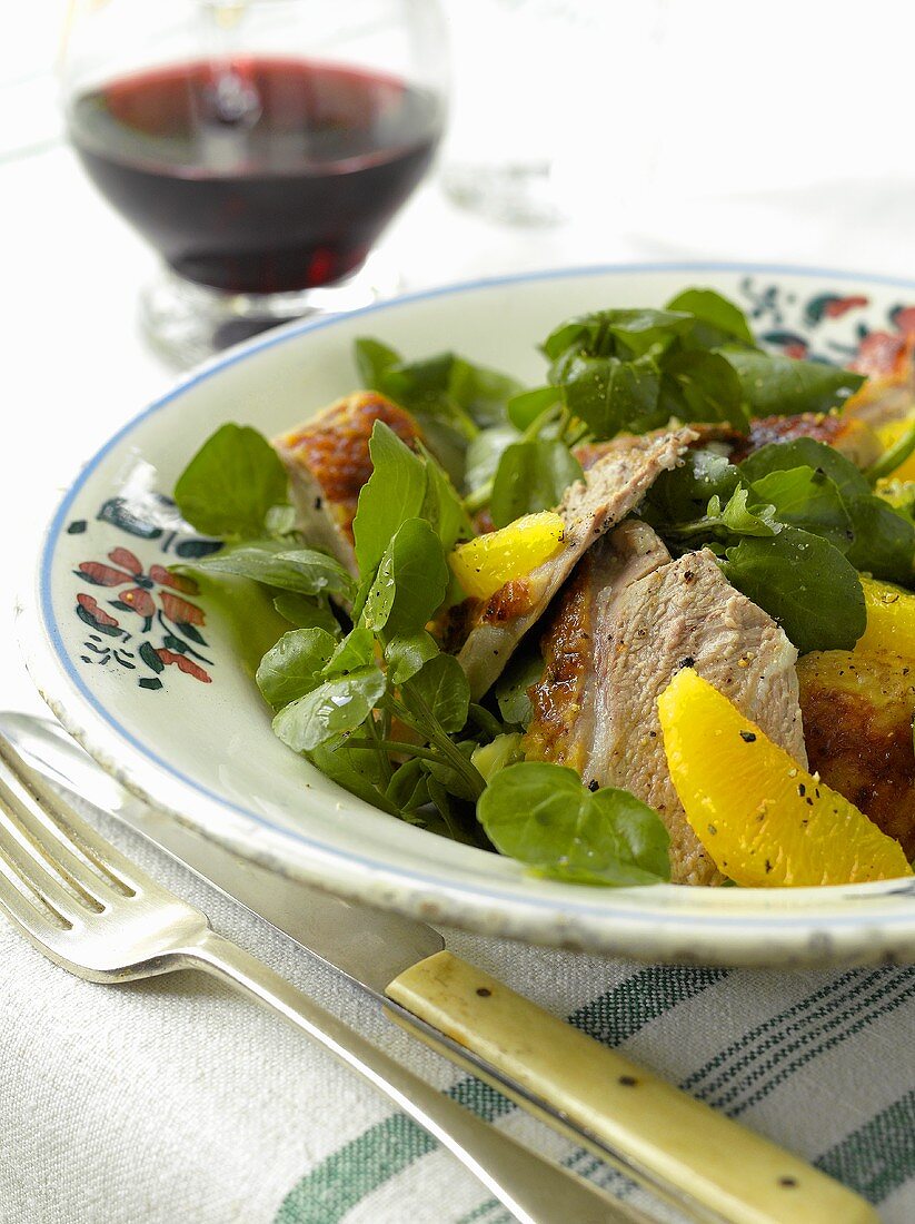 Roast duck breast with honey, oranges and water cress