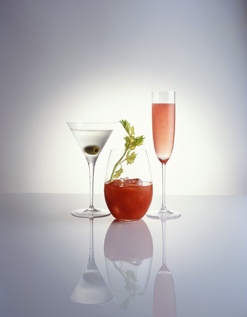 Three cocktails: Martini, Bloody Mary and Kir Royal