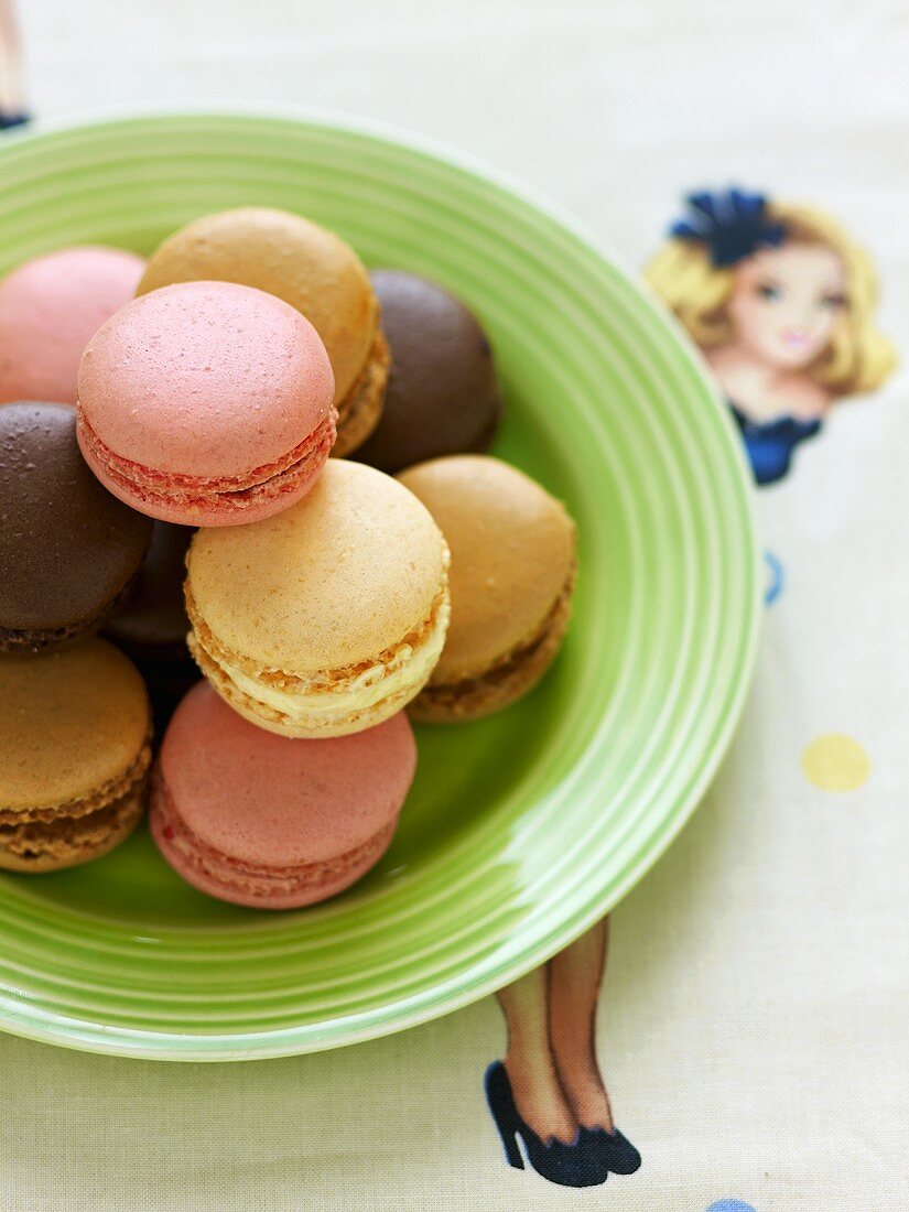 Macaroons on a green plate