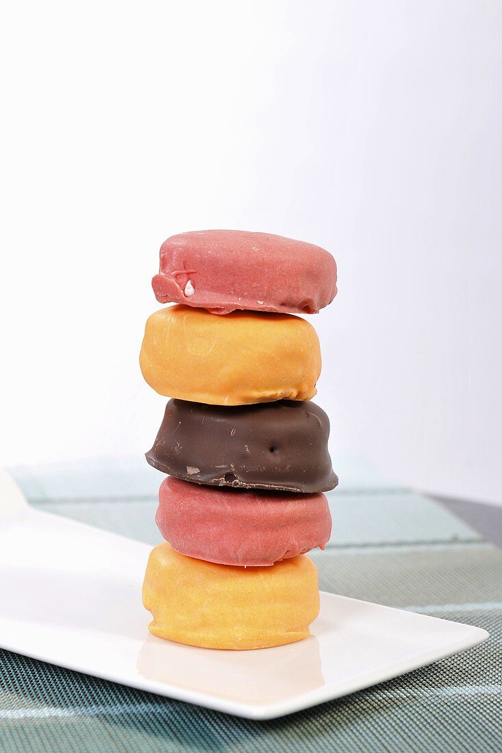 A stack of biscuits with decorated with icing