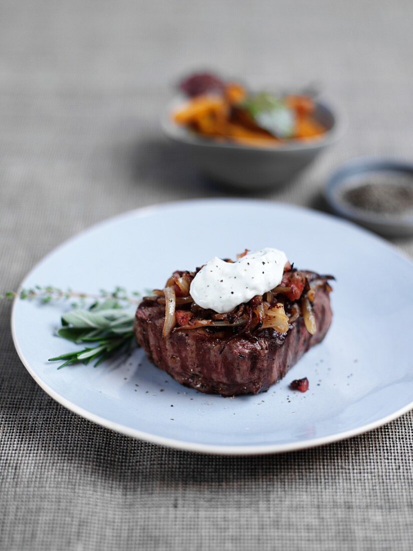 Beef steak with gorgonzola and onions