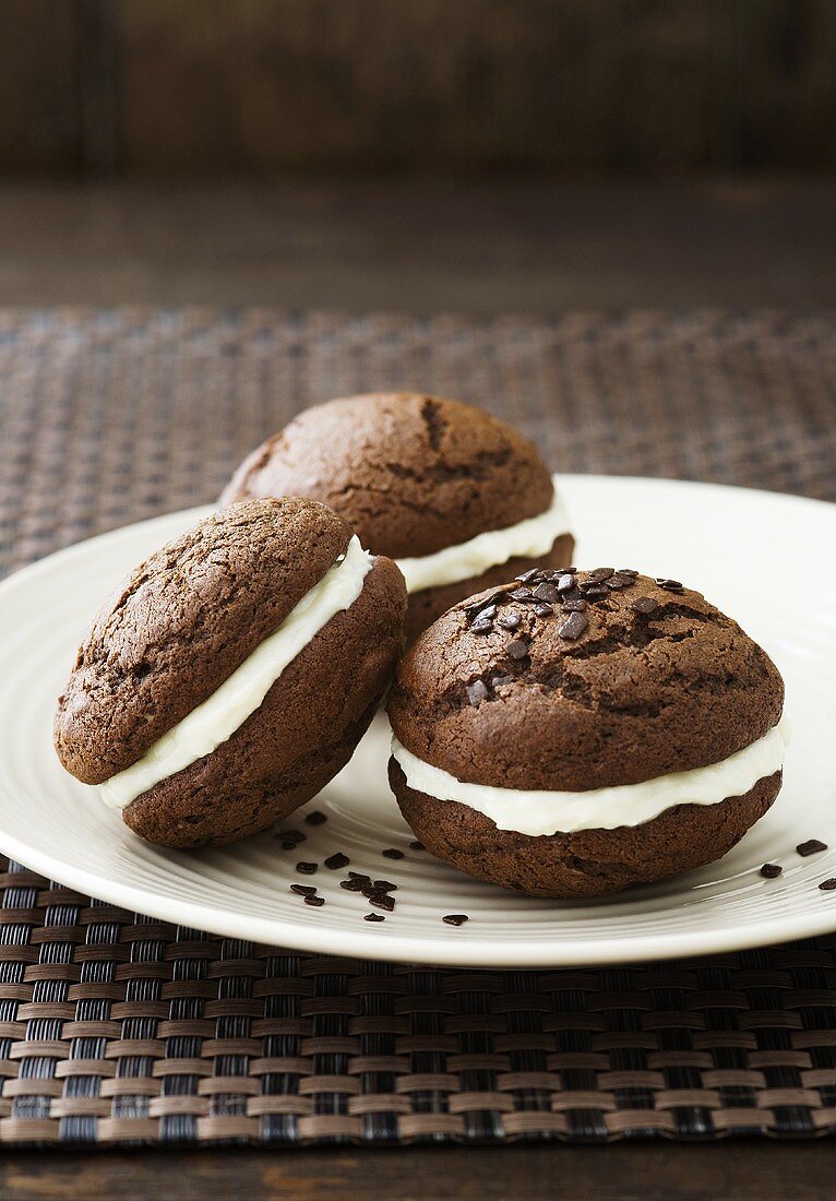 Chocolate Whoopie Pies with vanilla cream cheese and chocolate sprinkles