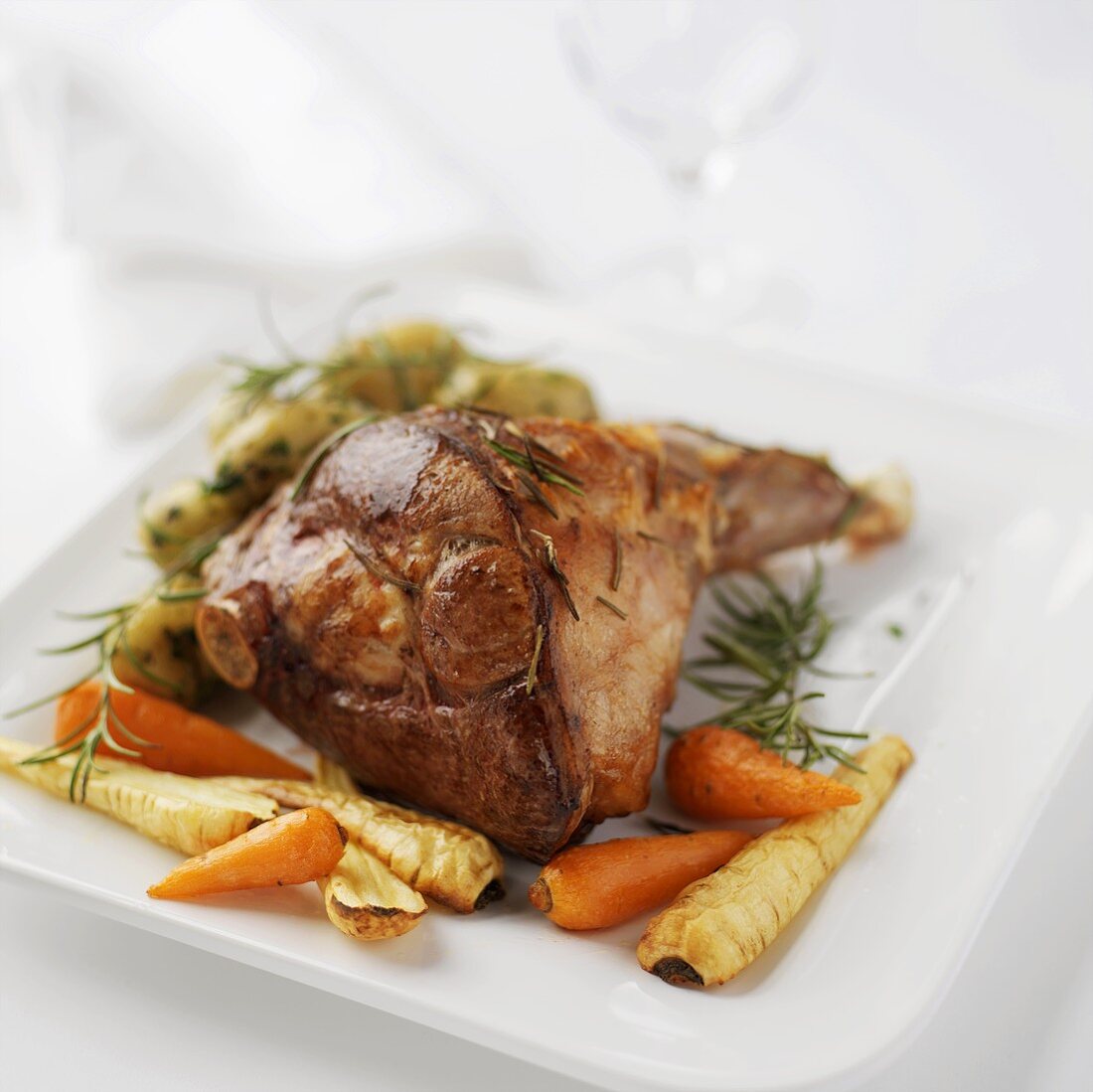 Roasted leg of lamb with rosemary and root vegetables