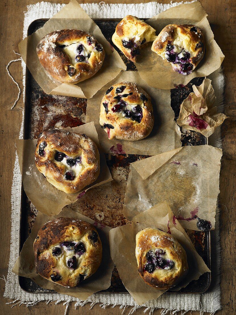 Blueberry buns on a baking tray