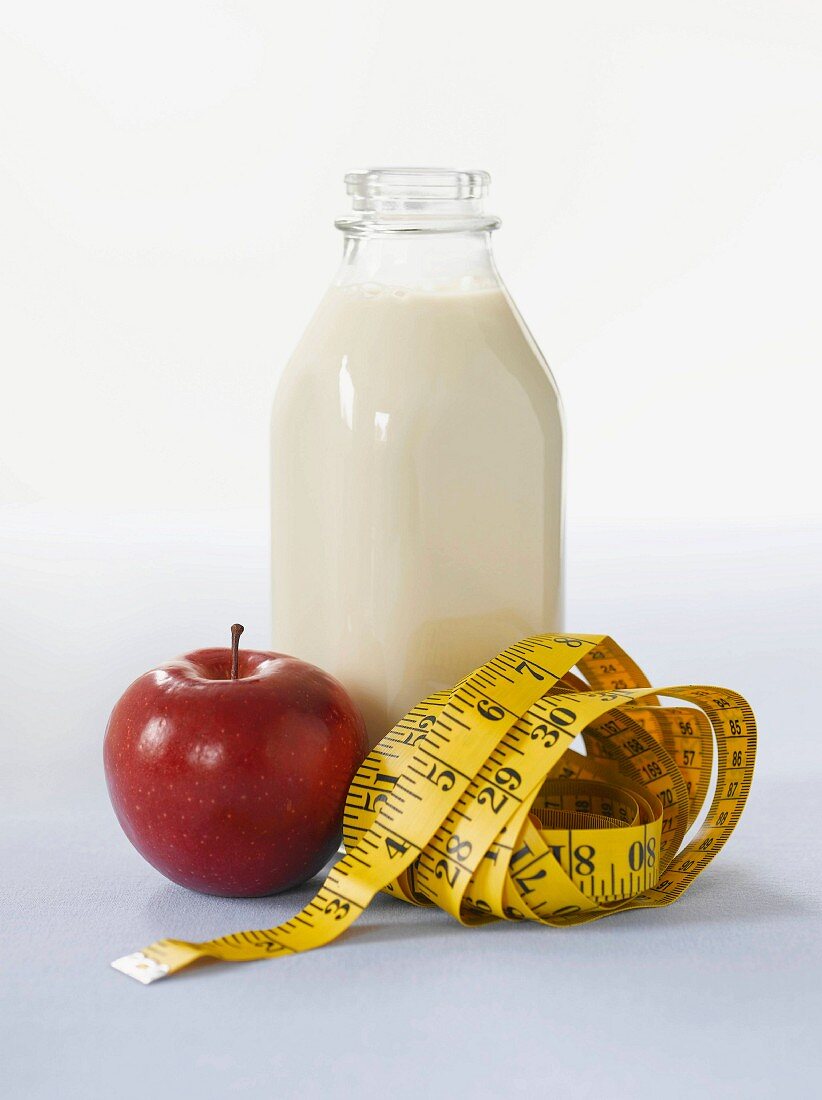 Milk, apple and tape measure
