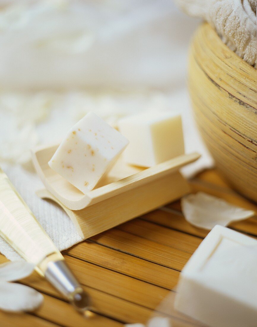 Cubes of soap on wooden soap dish