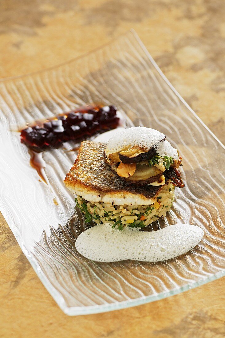 Fried bass on porcini mushroom risotto with beetroot jelly