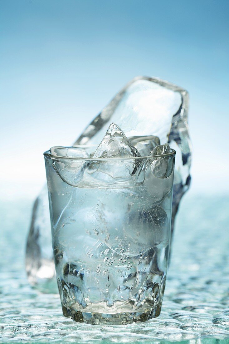 Glass of Water with Melting Ice Cubes