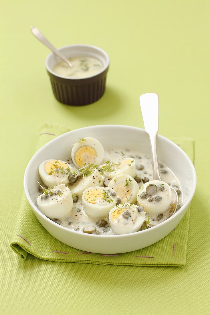 Hard boiled eggs in a caper sauce