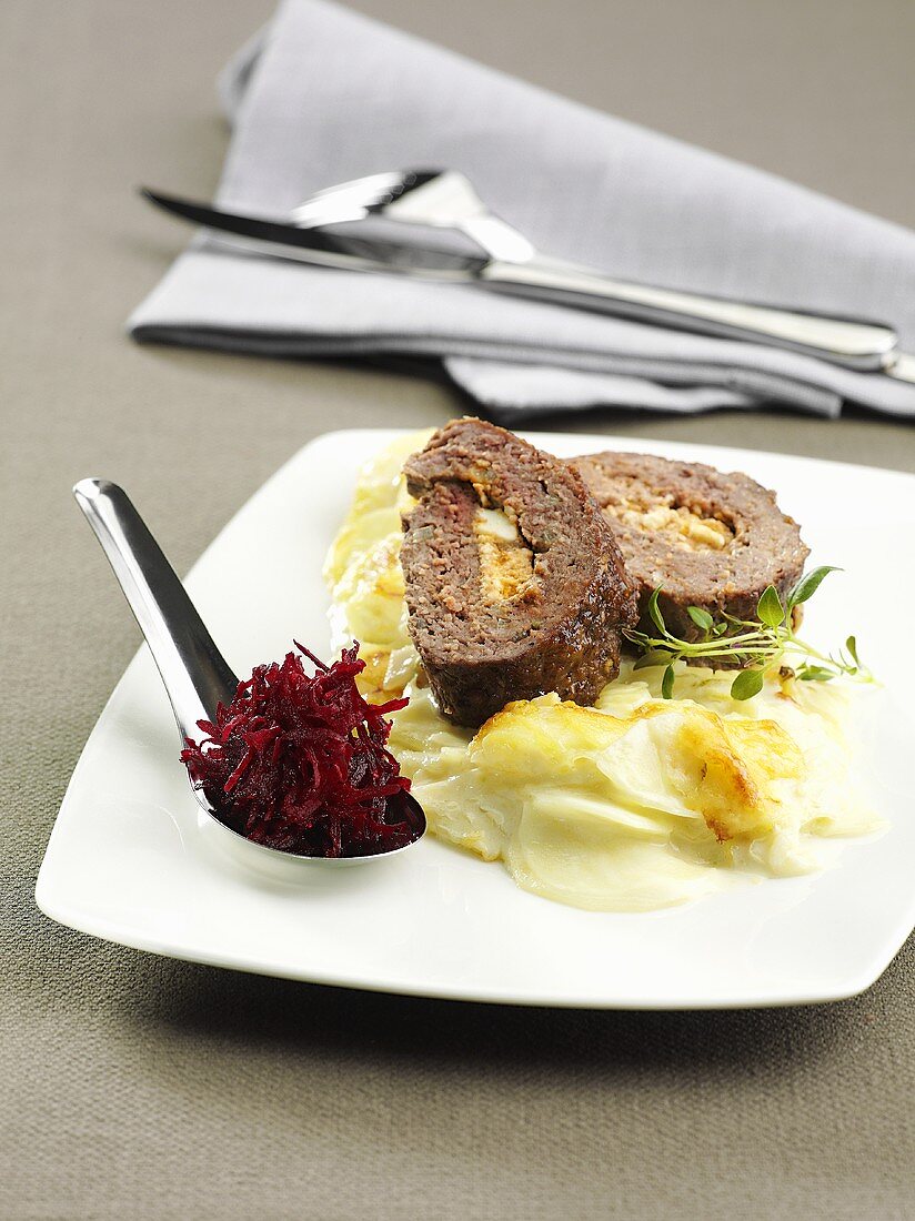 Meat loaf with mashed potato and grated beetroot