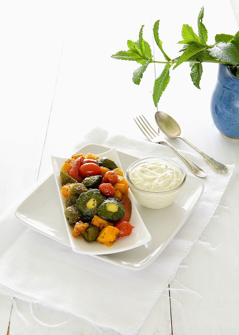 Oven baked summer vegetables with a feta-mint dressing
