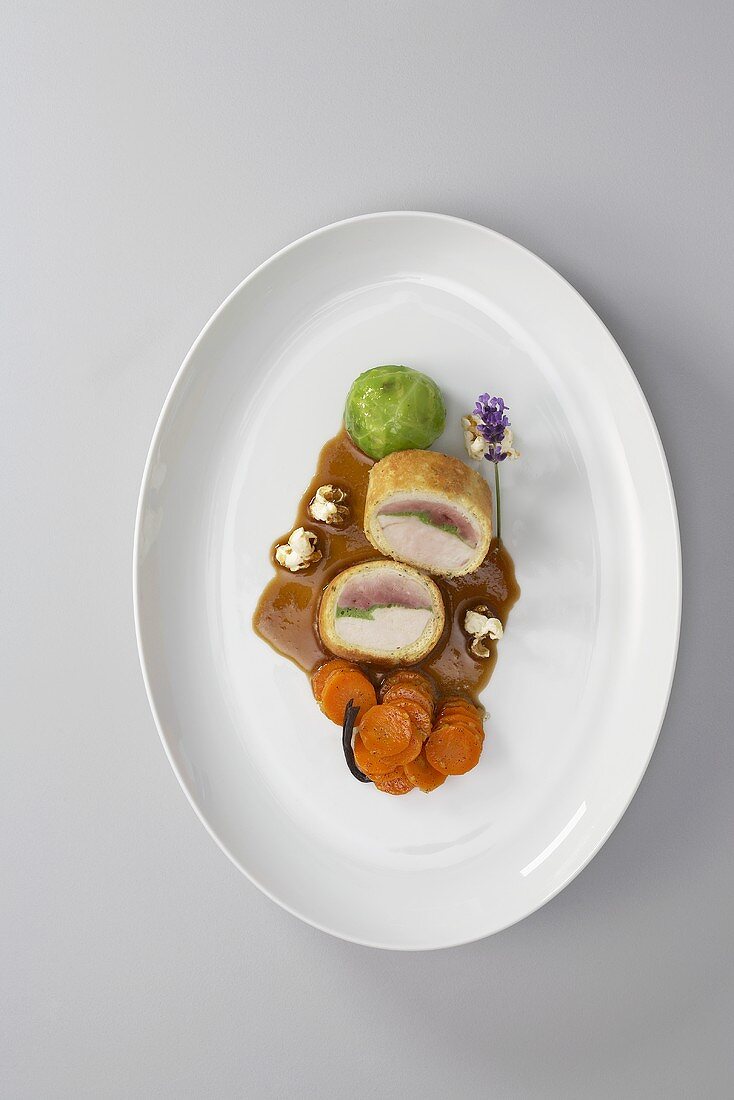 Quail and chicken breast in corn sponge with vegetables