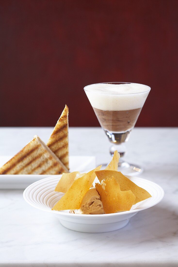 A trio of desserts: chocolate mousse, caramel ice cream and banana toast