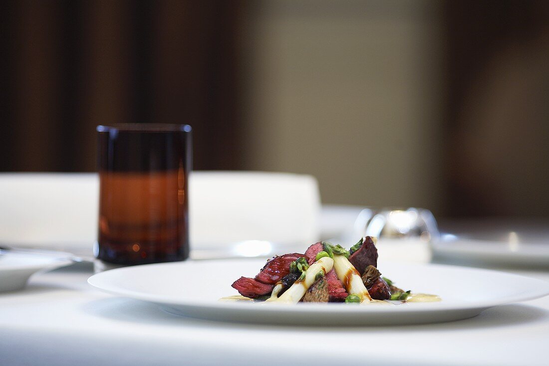 Saddle of venison with pistachios and asparagus