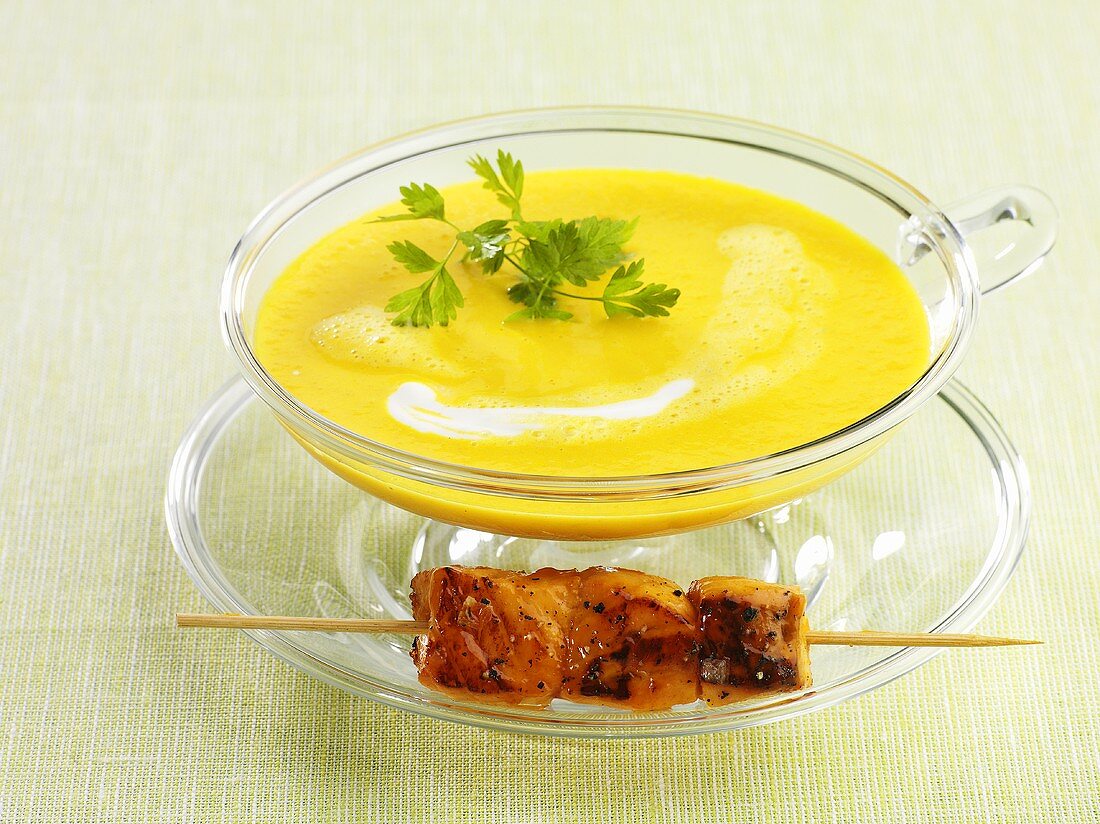 Carrot soup with a salmon kebab