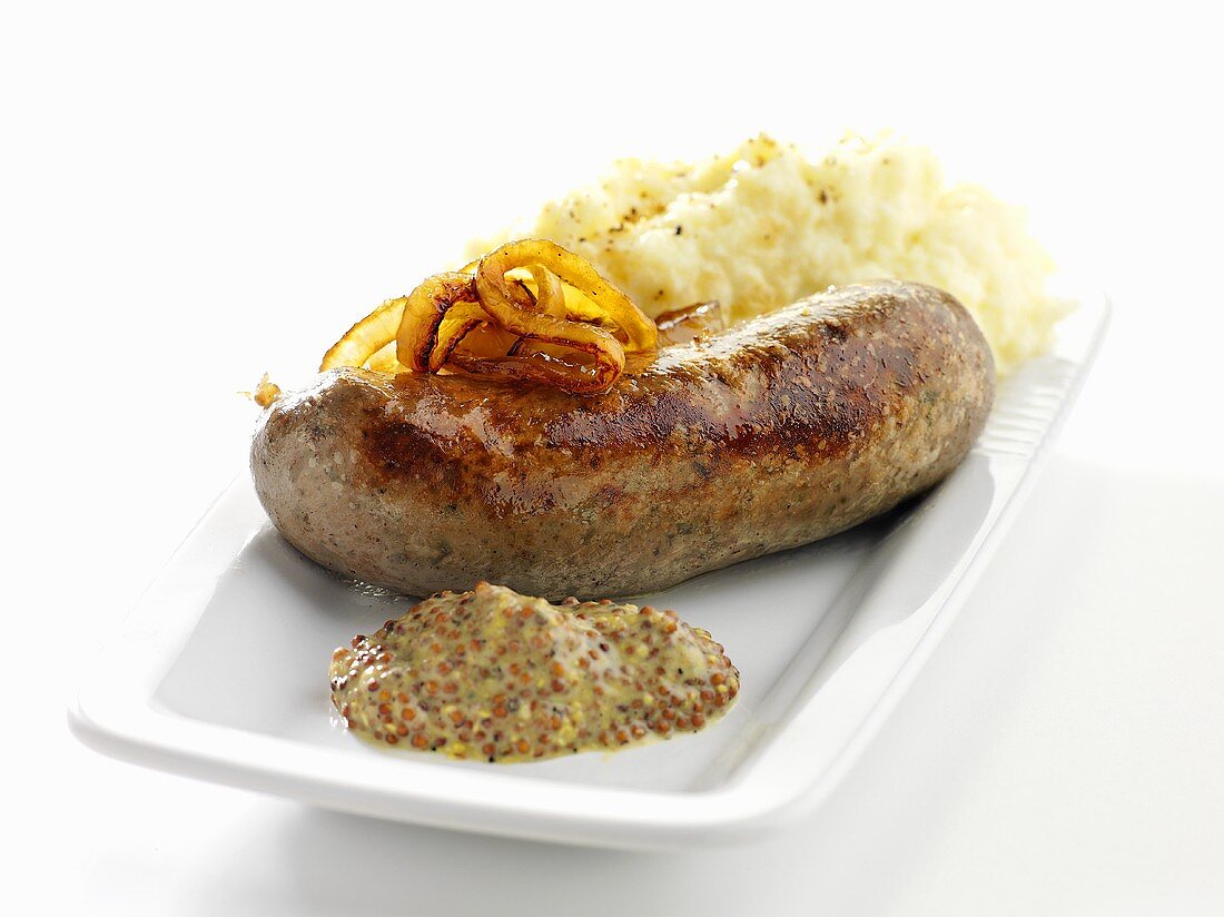 Bratwurst mit Senf, Zwiebeln und Kartoffelpüree