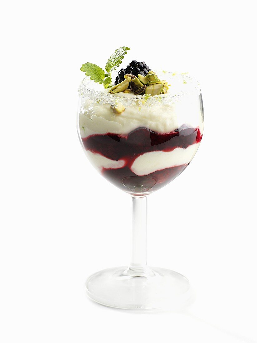 Quark cream with blackberries and pistachios