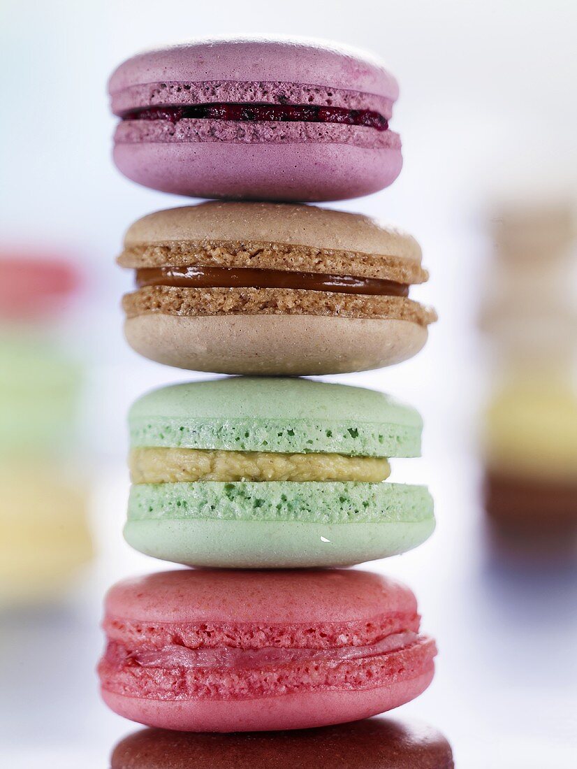 A stack of four colourful macaroons