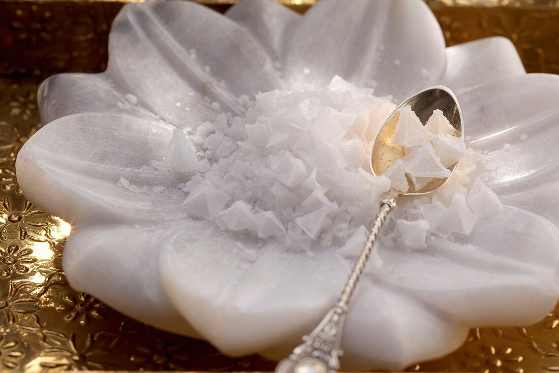 Fleur de sel and a spoon in a flower-shaped bowl