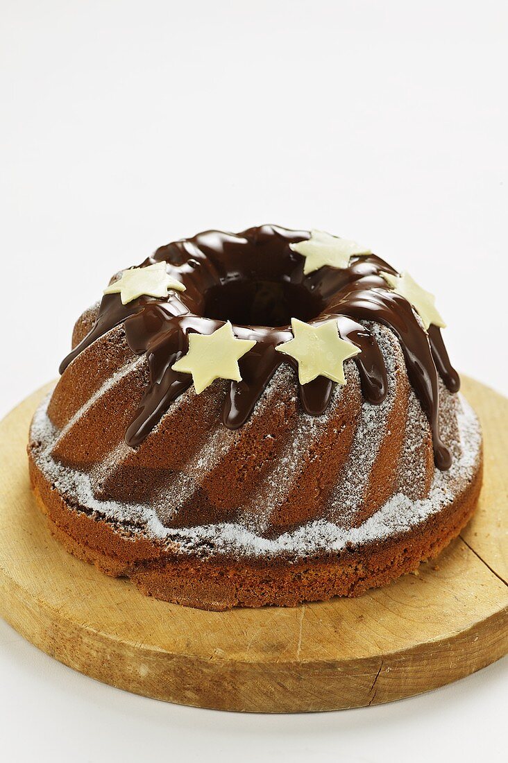 A Bundt cake with chocolate icing and stars
