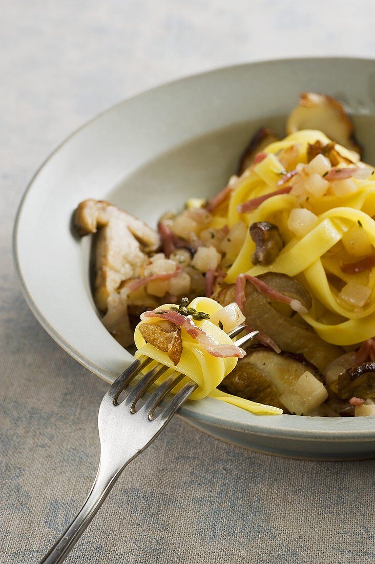 Pasta alla trentina (pasta with porcini mushrooms, bacon and pears)