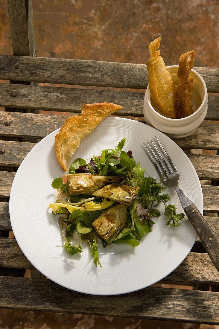 Carciofi su insalata al pecorino (artichokes on a bed of salad)