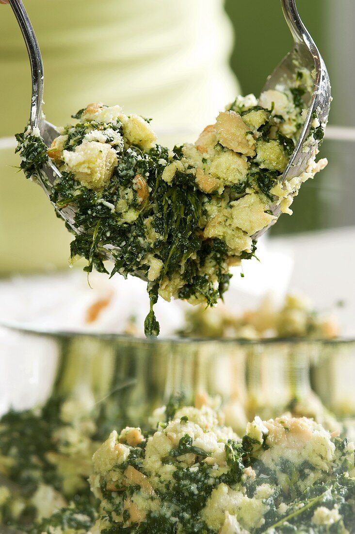 Spinach gnocchi, dough consistency being prepared