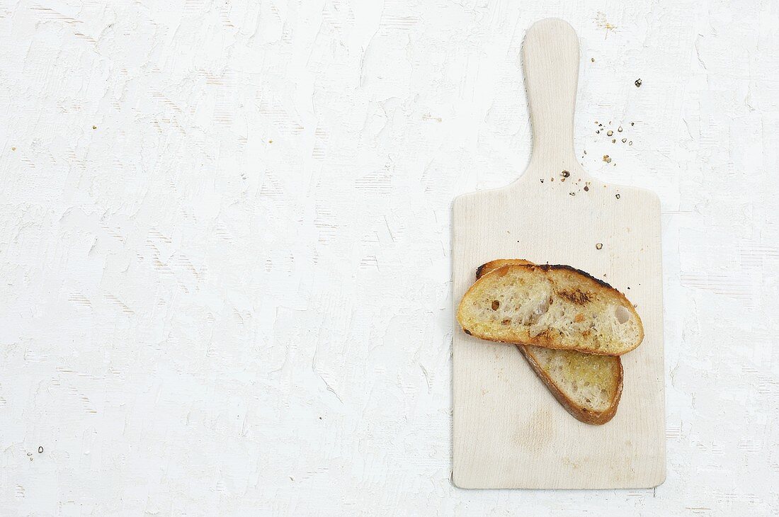 Toasted bread on a chopping board