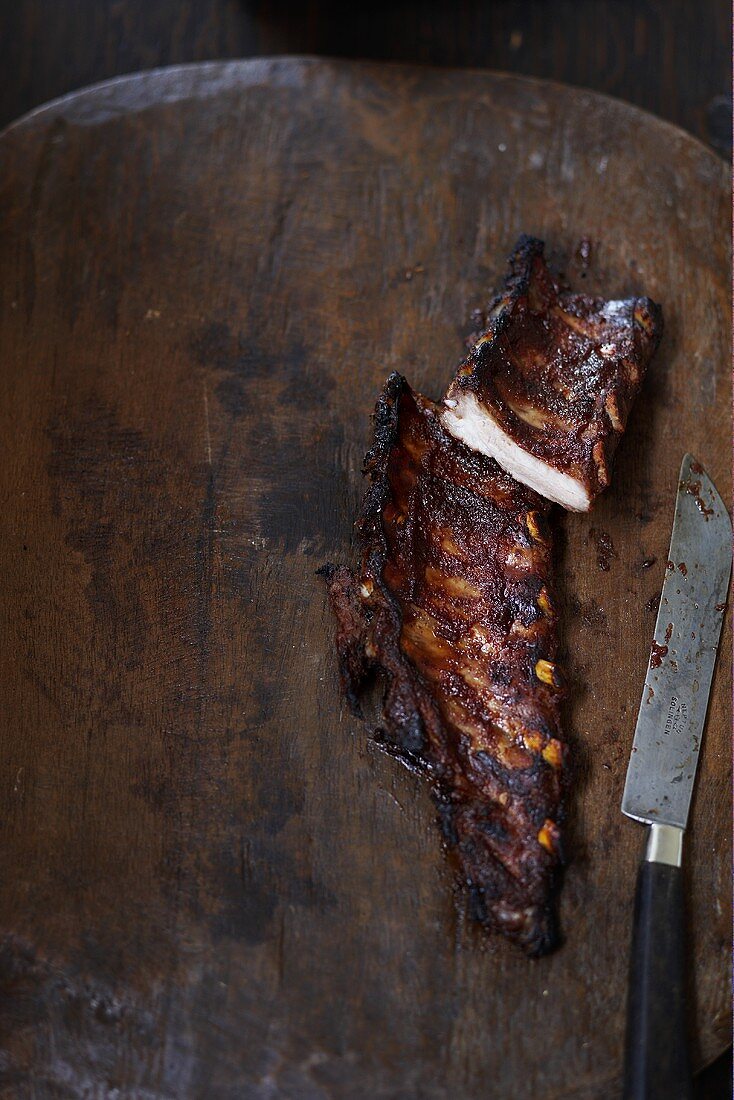 Marinated spareribs with gingerbread spice on a wooden background