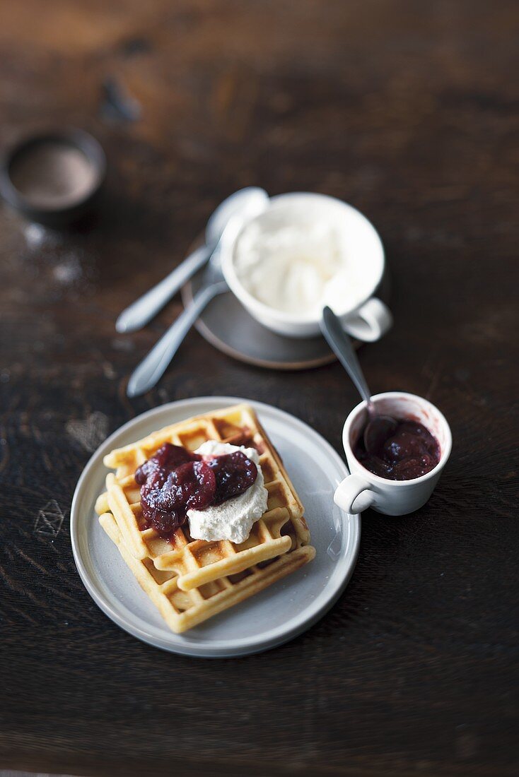 Buttermilk waffles with plum compote and whipped cream