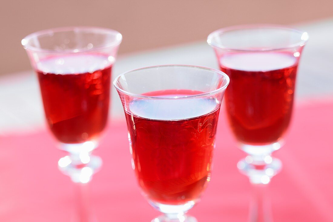 Three glasses of cherry liqueur