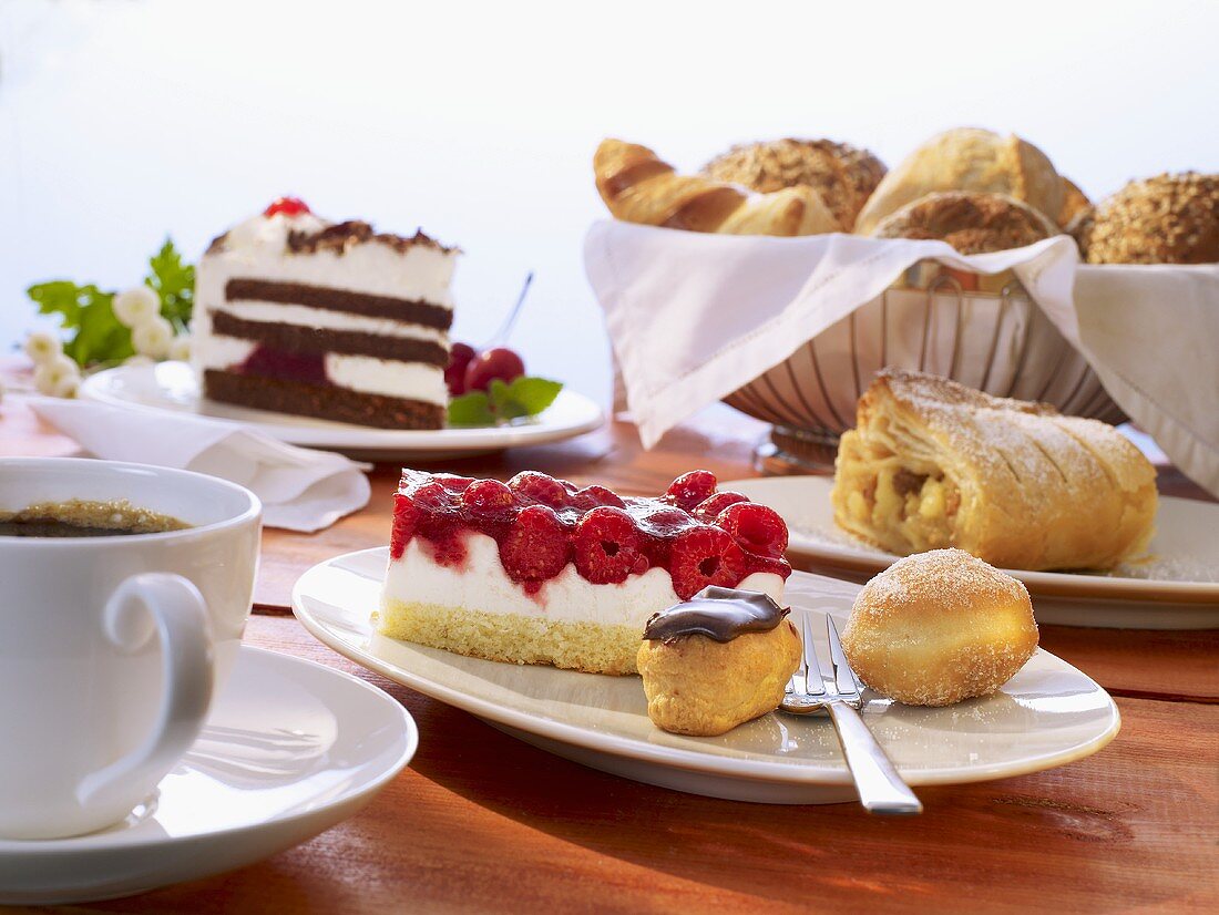 Various type of fresh and frozen cakes and a cup of coffee