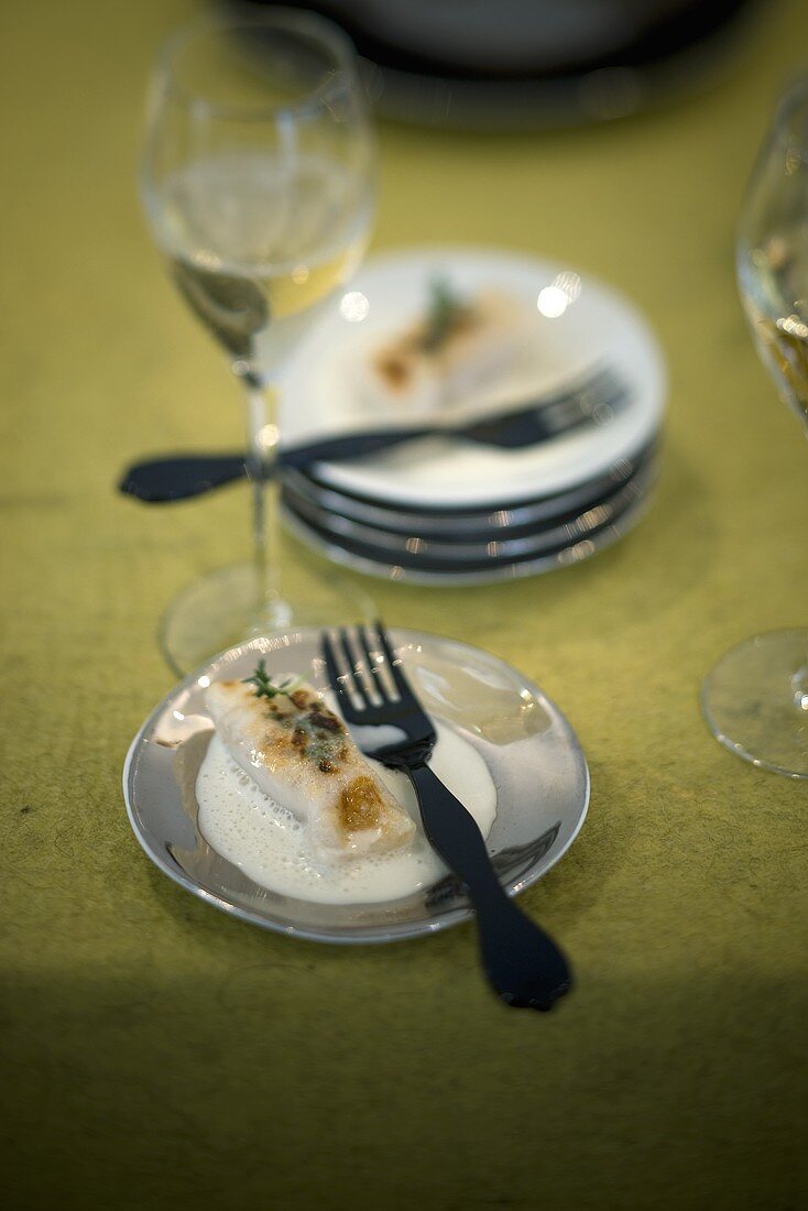 Turbot in rice leaves on a white wine sauce