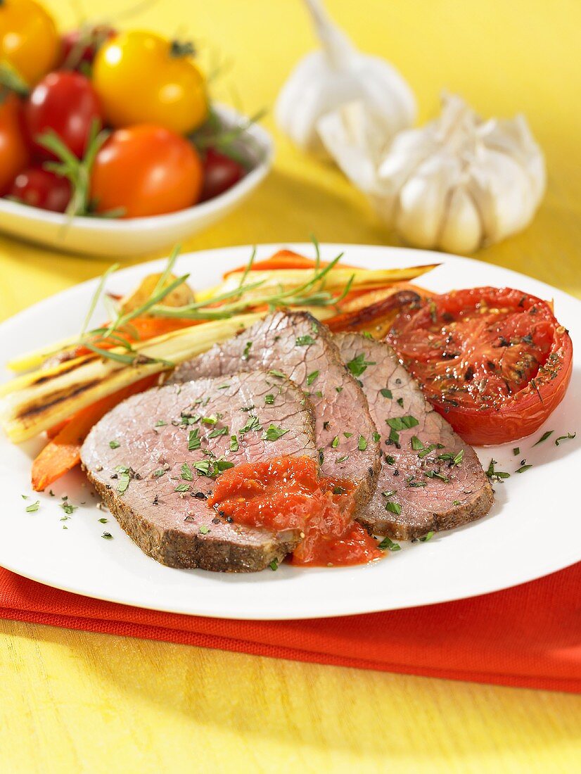 Sliced roast veal fillet with vegetables