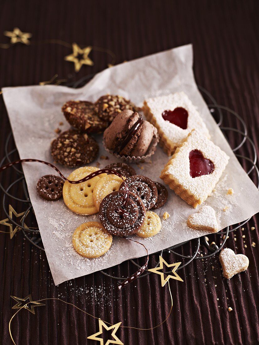Various Christmas biscuits on paper