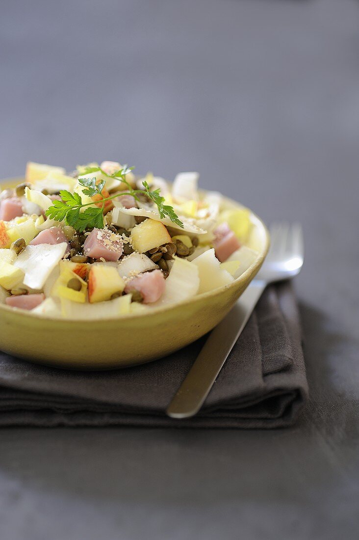 Lentil salad with bran, apple and chicory