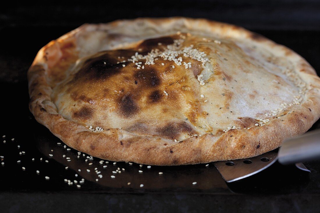 Calzone sprinkled with sesame