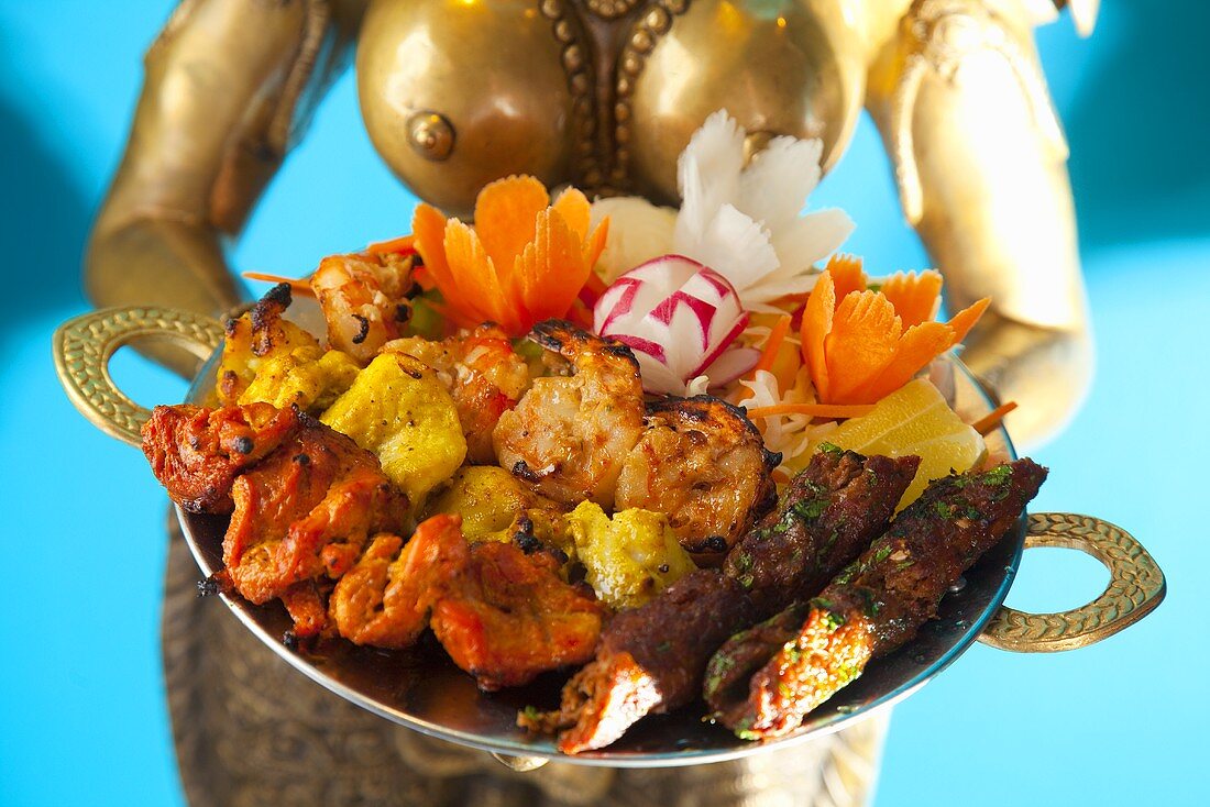 An Indian platter of lamb, prawns and chicken