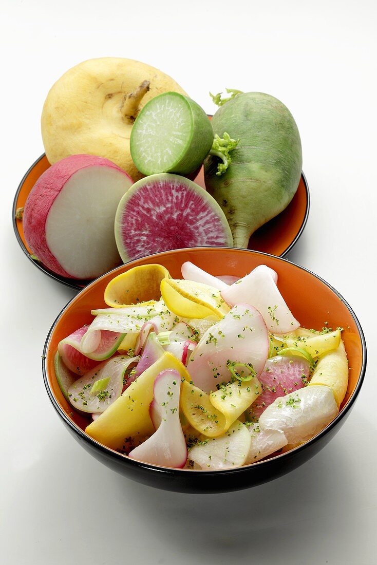 Sliced radishes in bowls as salad