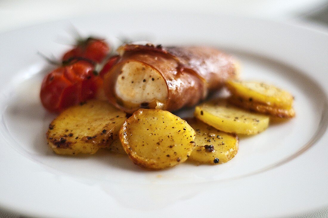 Monkfish wrapped in bacon with roasted potatoes