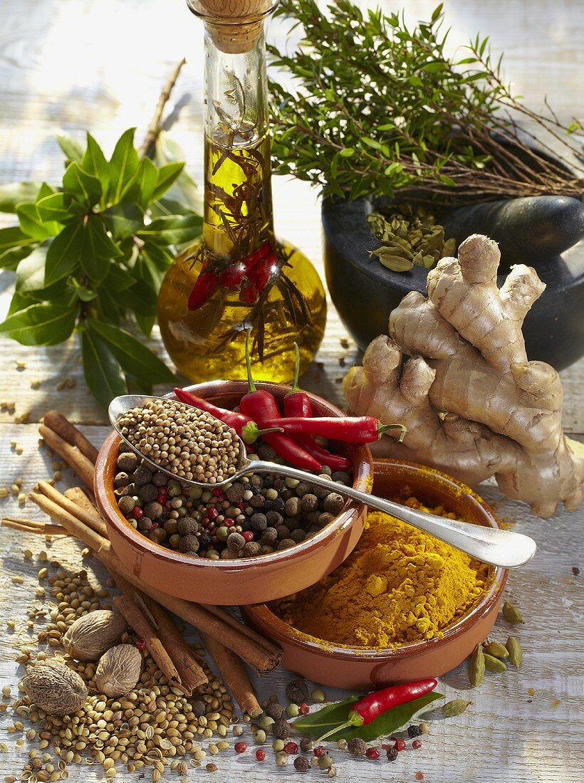 Sill life with spices, herbs and herb oil