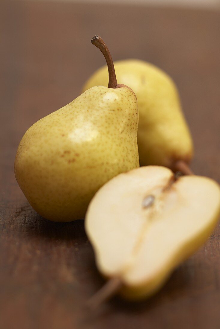Two whole and one half of a dessert pear