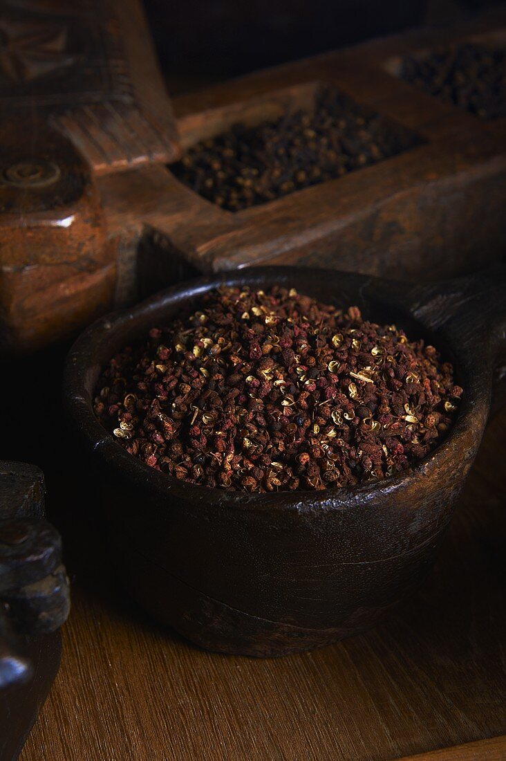 Szechuan pepper in a wooden bowl