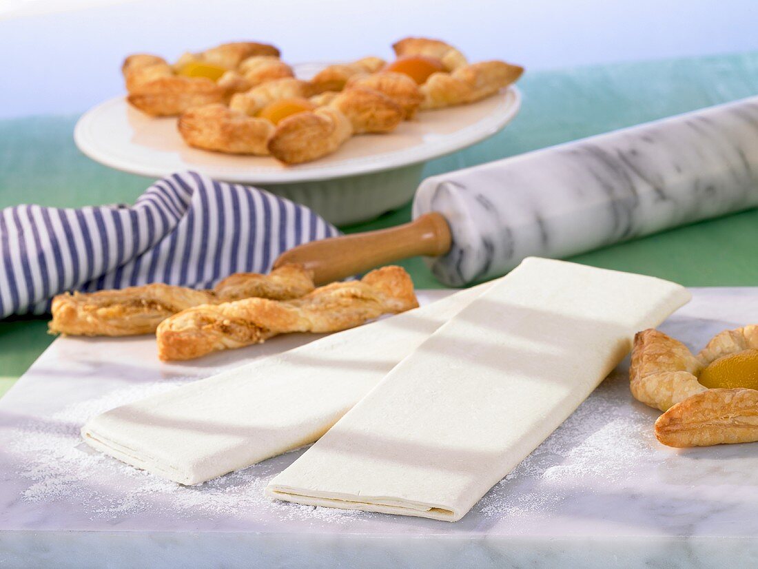 Baked good made with puff pastry ('Blätterteigstangen' puff pastry rods, 'Windräder' wind wheels)