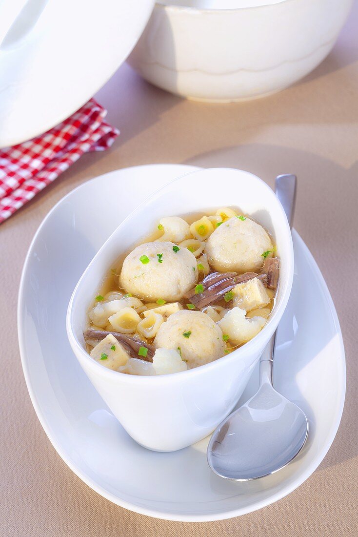 Spring soup with beef, noodles and bone marrow dumplings