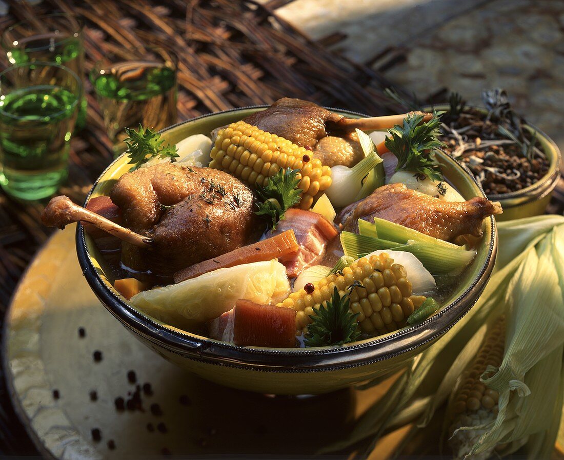 Pot au feu with chicken, vegetables and corn cobs