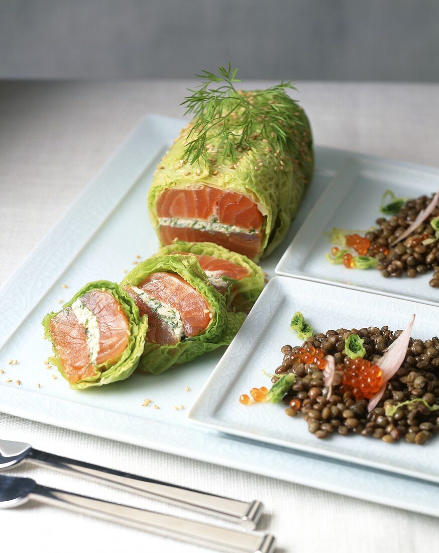 Salmon fillet wrapped in a savoy cabbage leaf with lentils and caviar