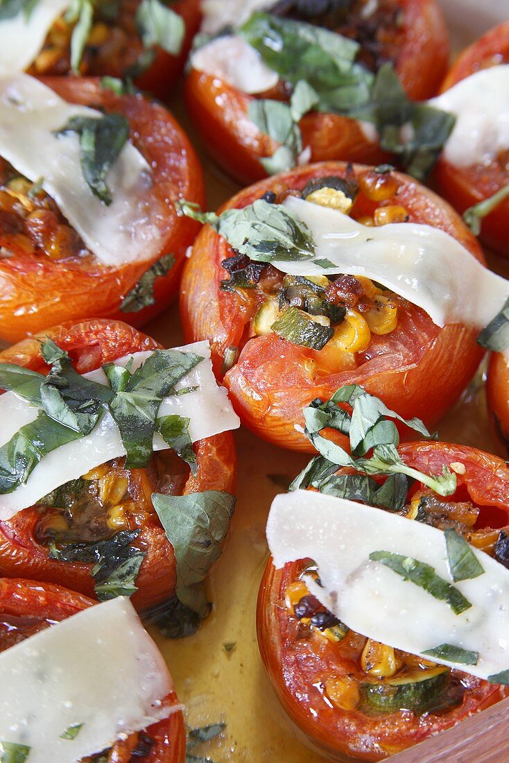 Stuffed tomatoes with corn, onions, bacon, garlic and Parmesan