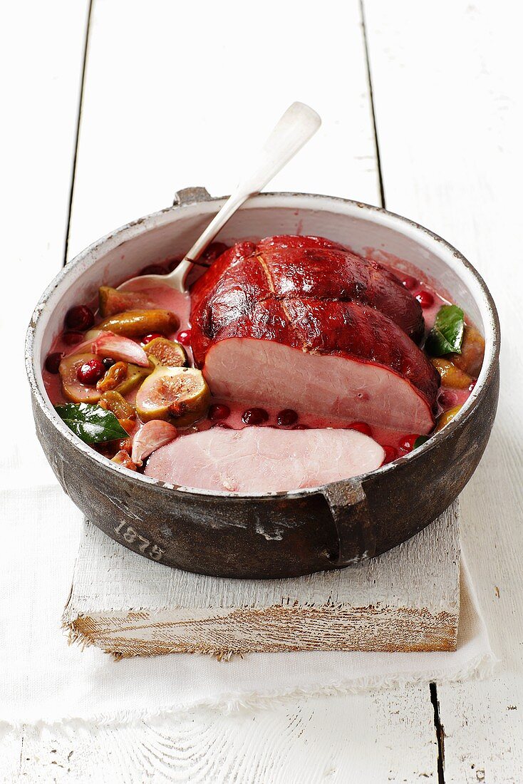 Ham braised in wine with figs and cranberries